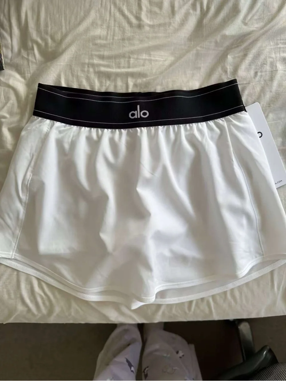 ALO Yoga White Mini Skirt with Black Logo Waistband